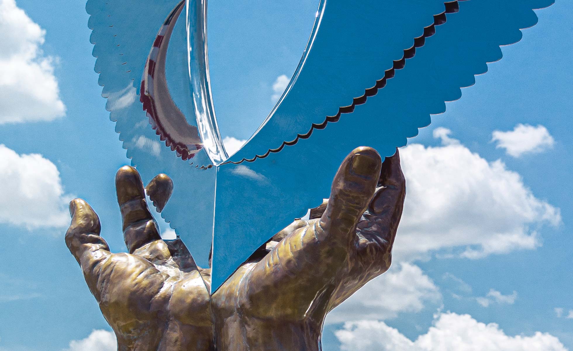 wings of hope, hands of healing sculpture