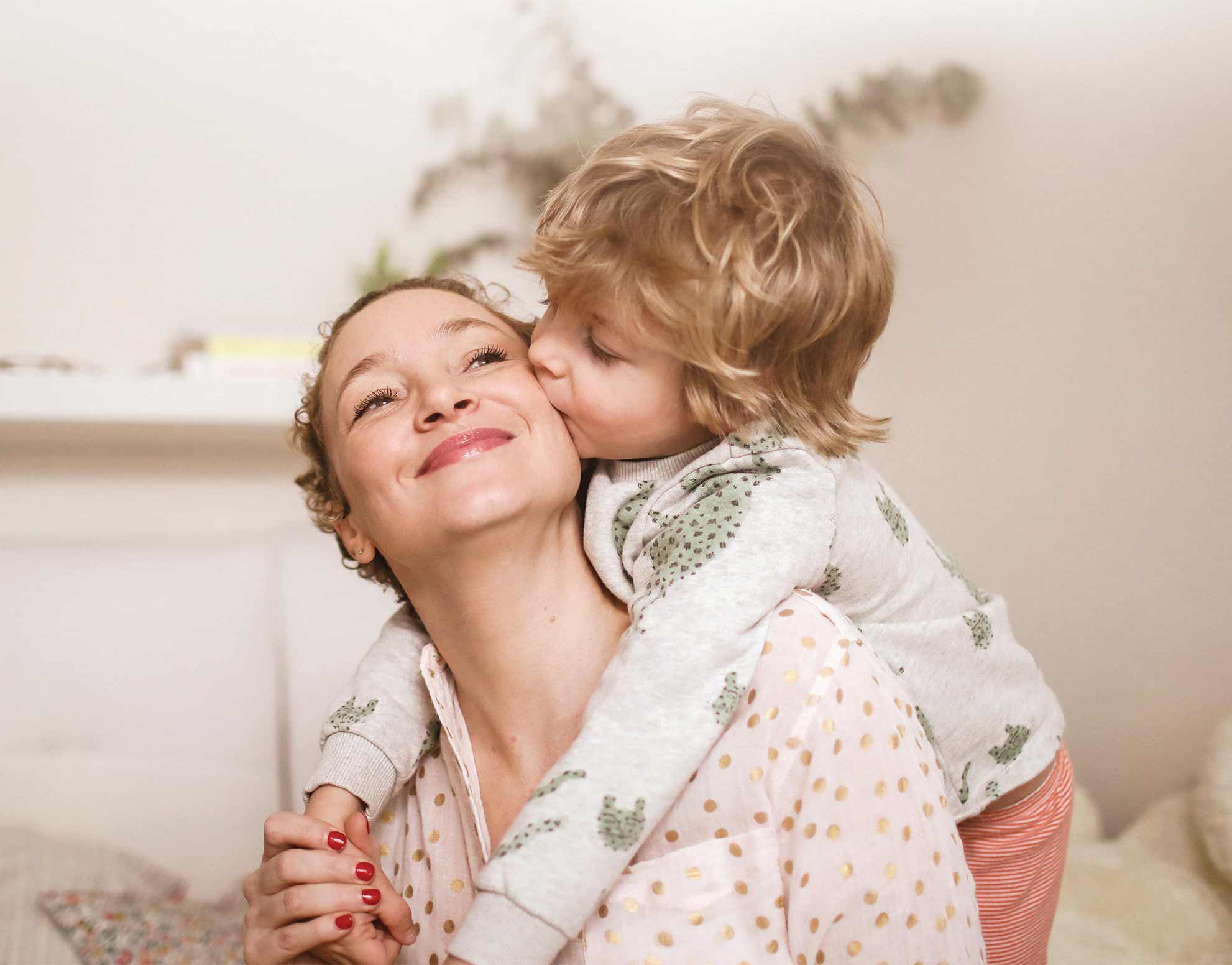 Mother and son hug