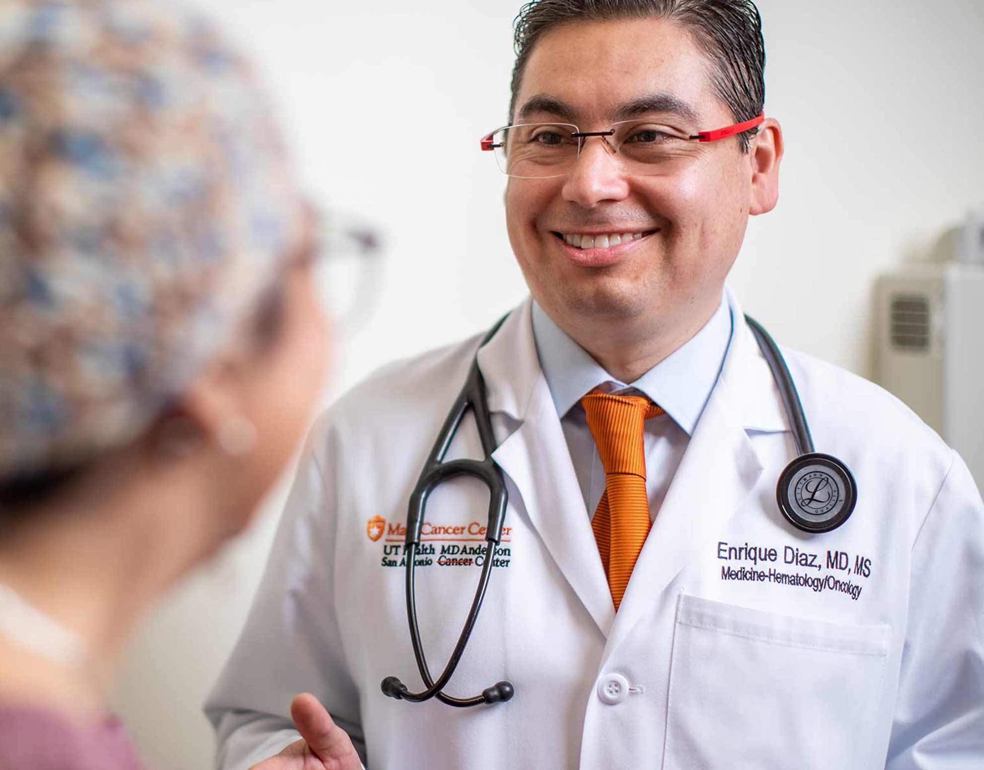 Photo of Dr. Enrique Diaz with a patient