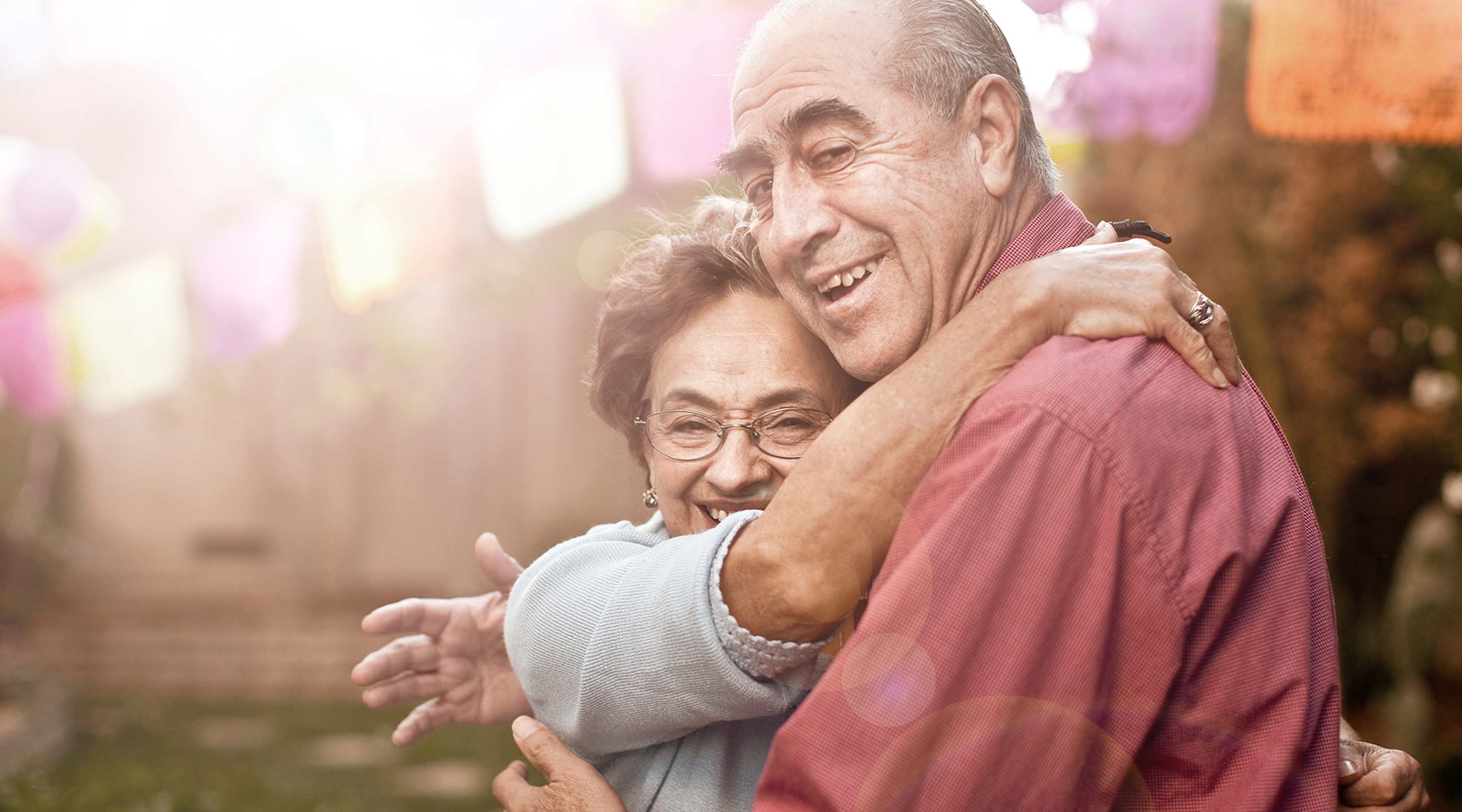 Photo of an elderly couple hugging