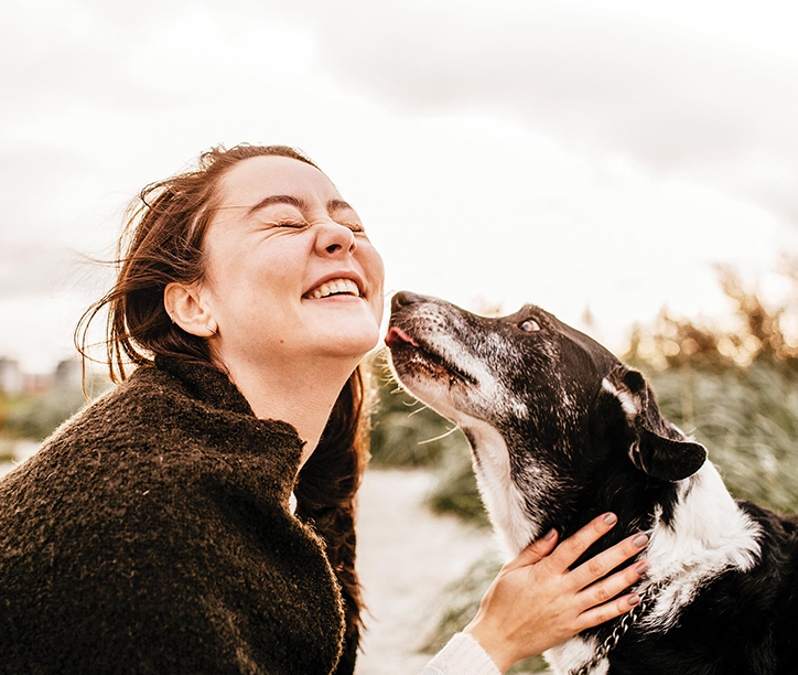 girl petting her dog