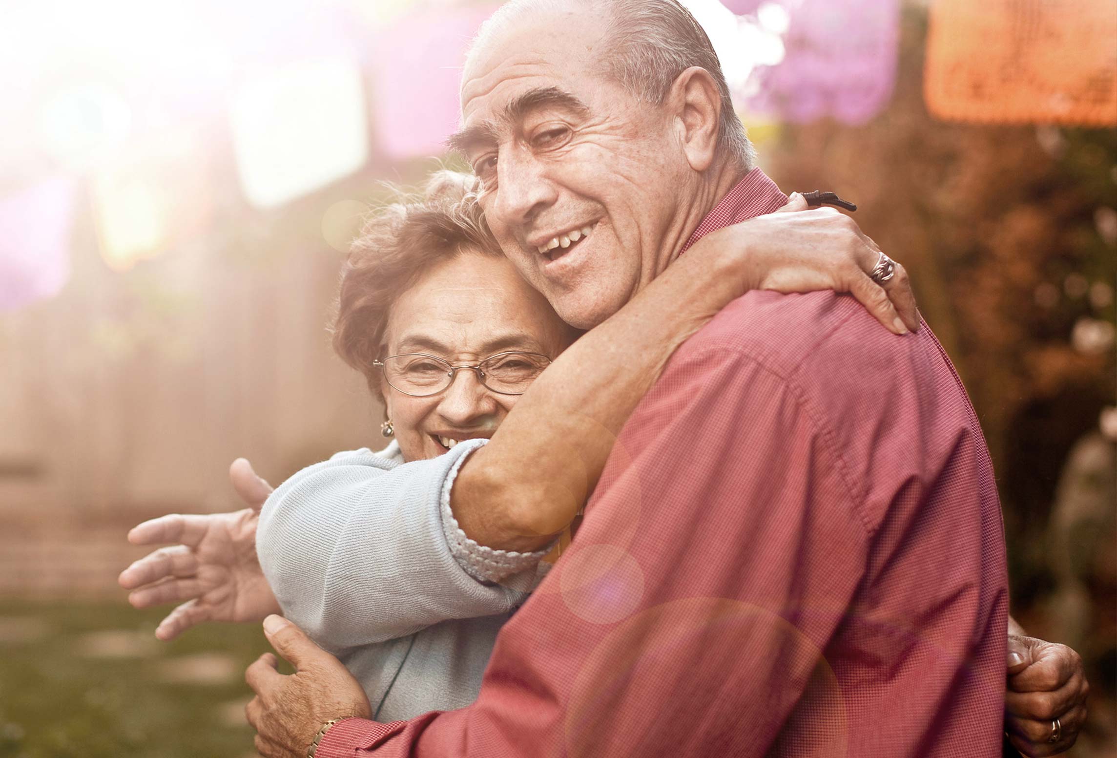 couple smiling and hugging