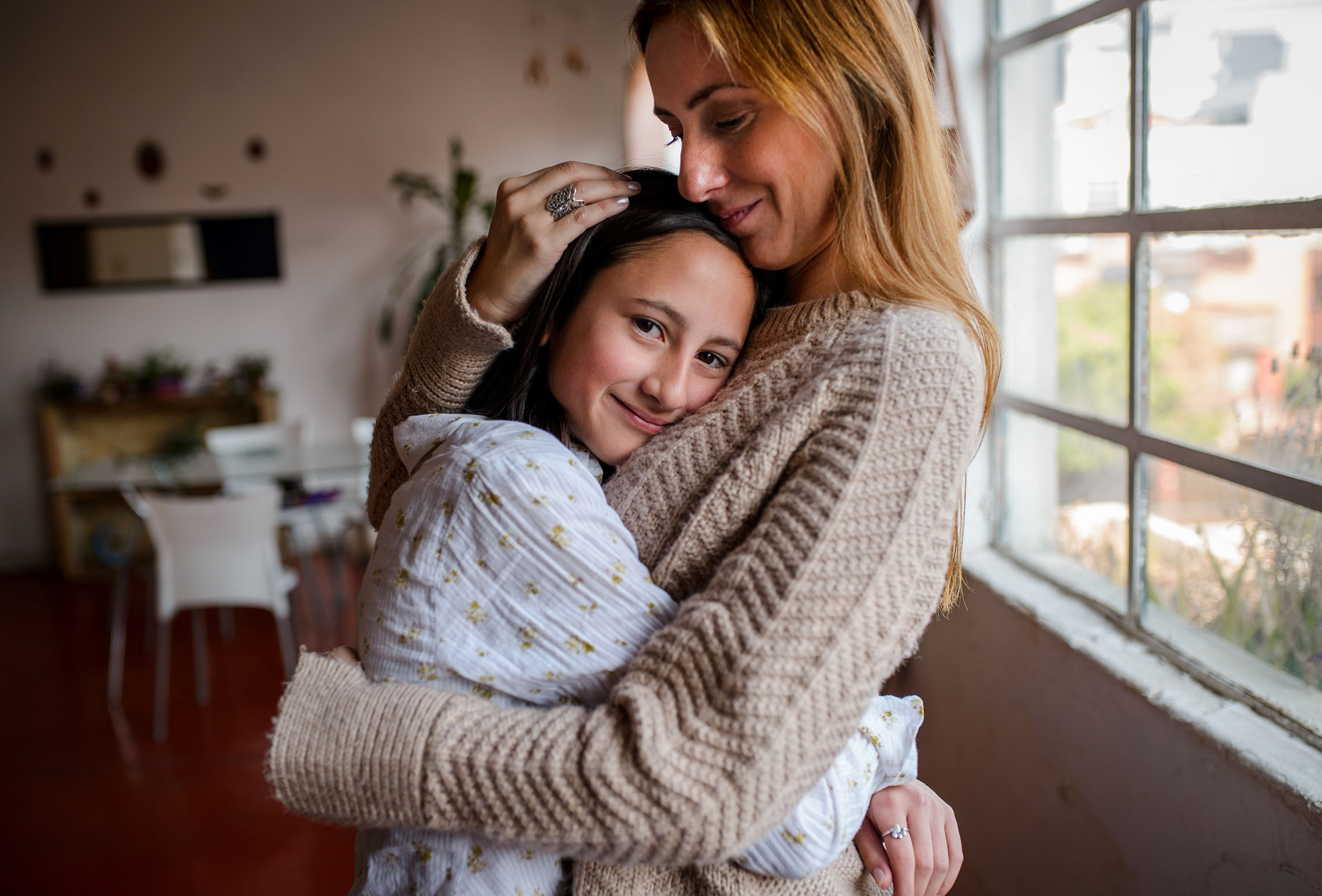 mother and daughter hugging