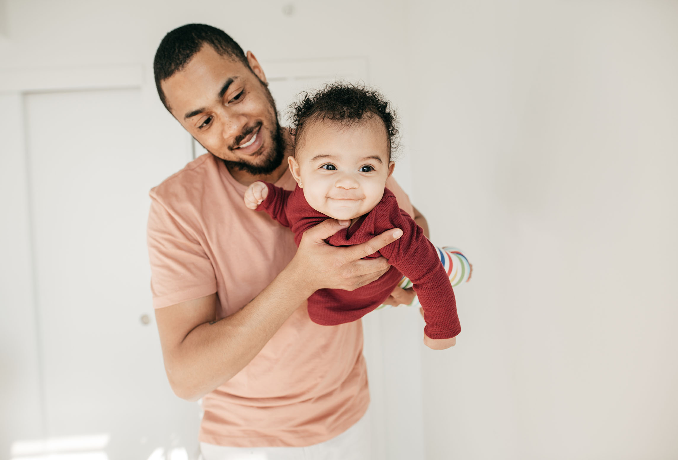 father holding his baby