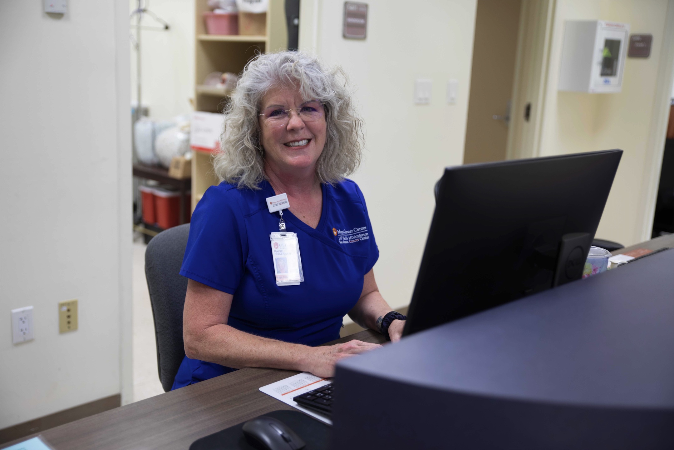 Mary Paig Cokerham RN working at her desk