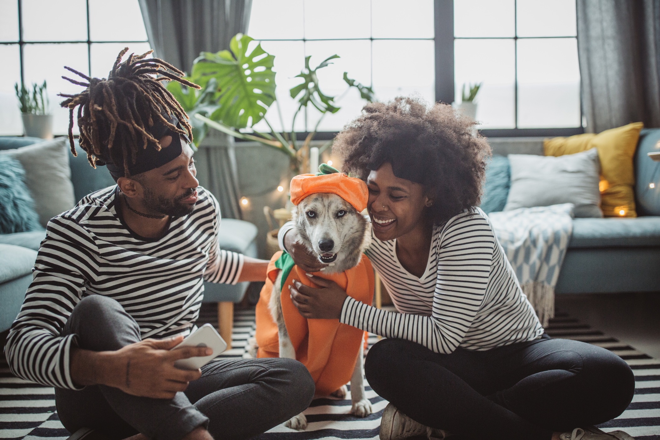 Couple dresses up with dog for Halloween