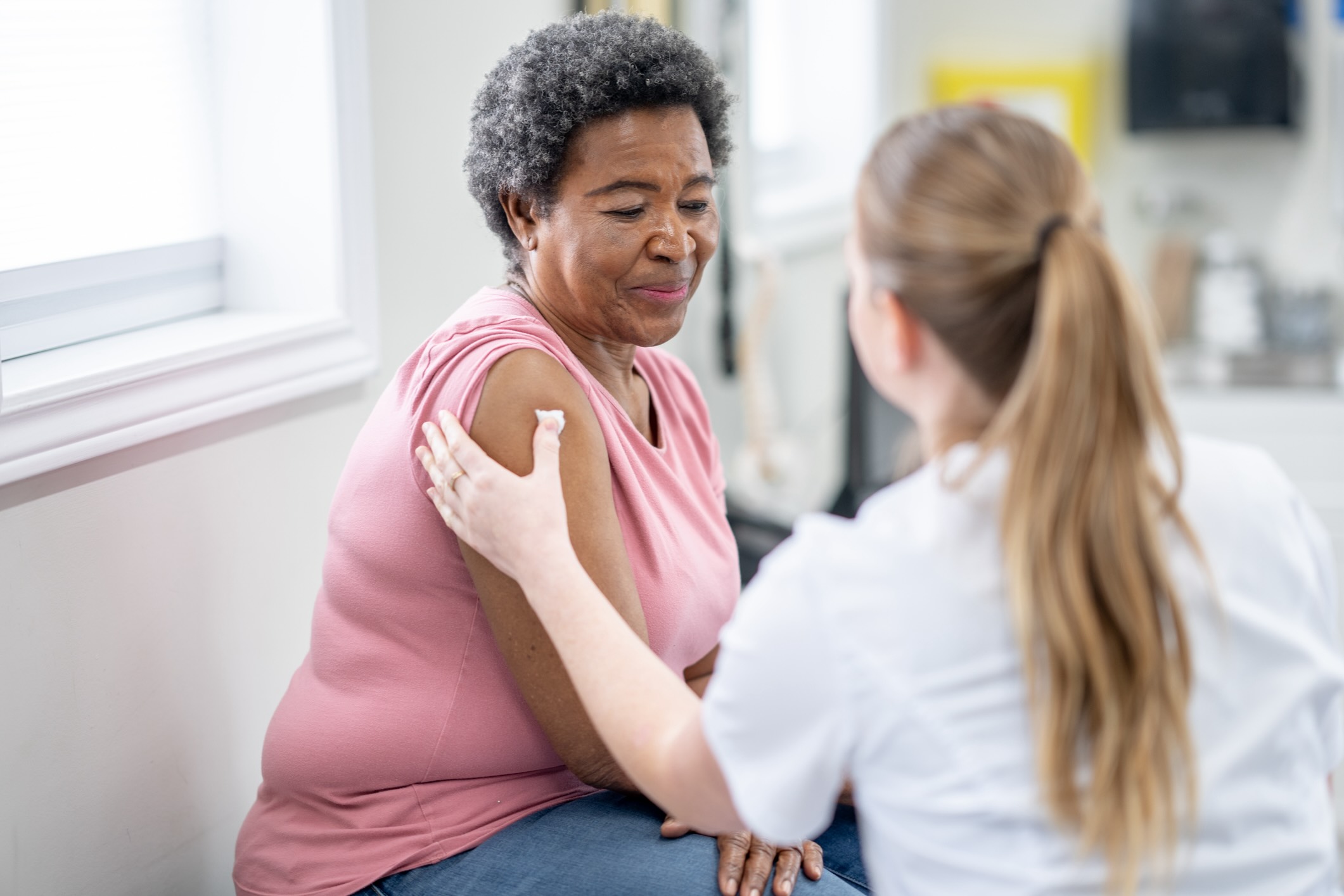 Black woman getting a vaccination