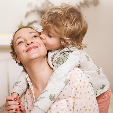 Mom and child hugging