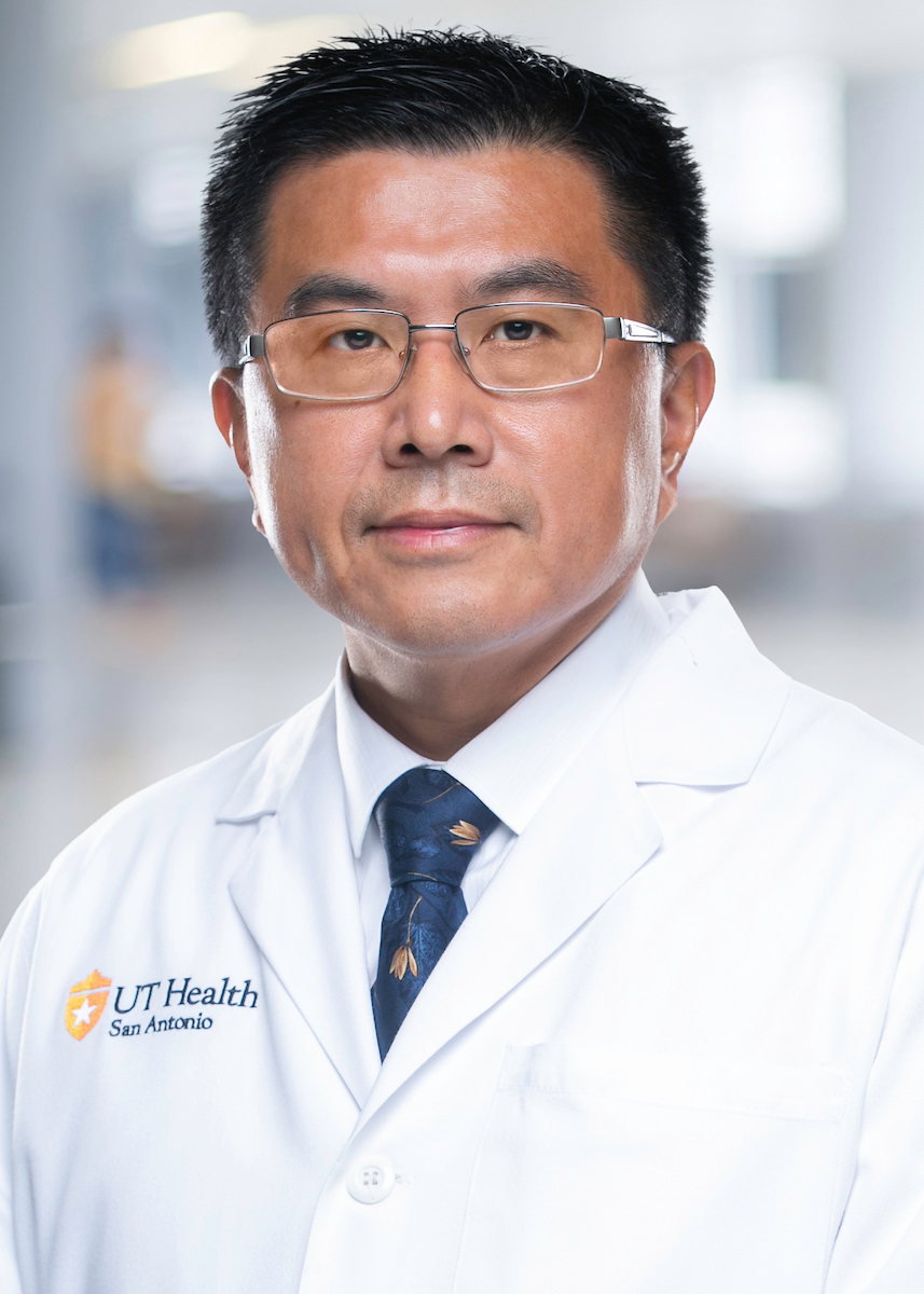 Dr. Zheng in a white coat