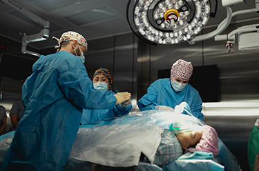 Surgeons operating on a patient 