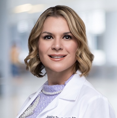 Dr. Jessica Jones in a white coat