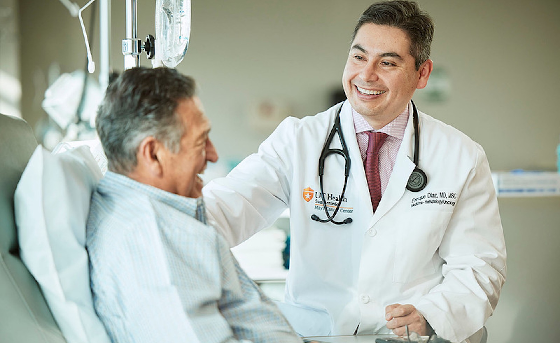 Enrique Diaz Mays Cancer Center smiling with patient