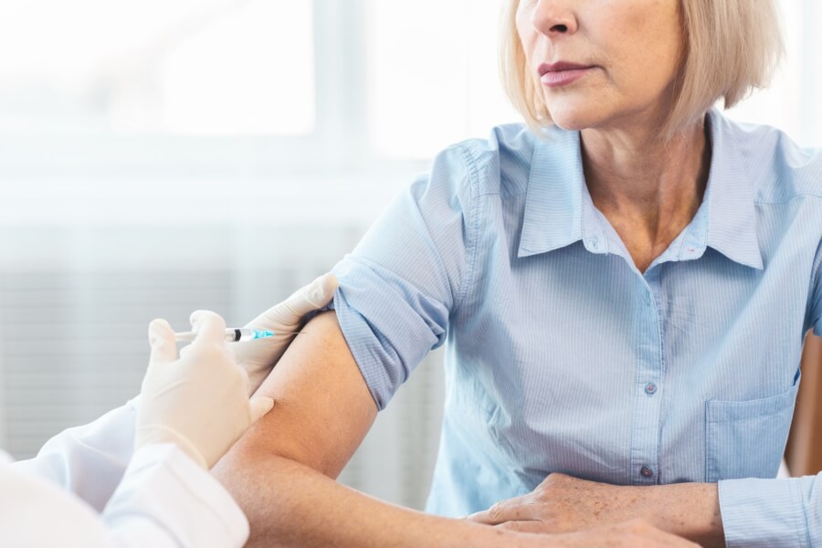 Photo of woman being vaccinated