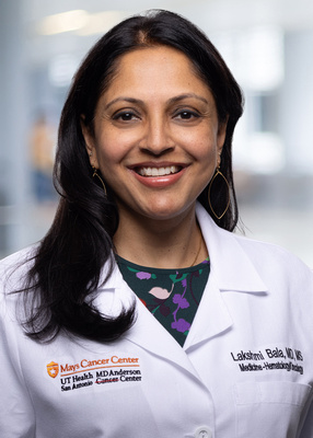 Dr. Bala white coat headshot