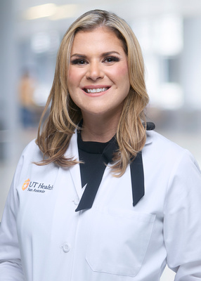 Dr. Jones white coat headshot