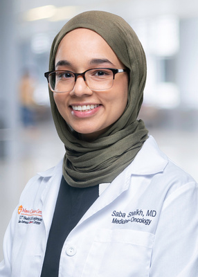 Dr. Shaikh white coat headshot