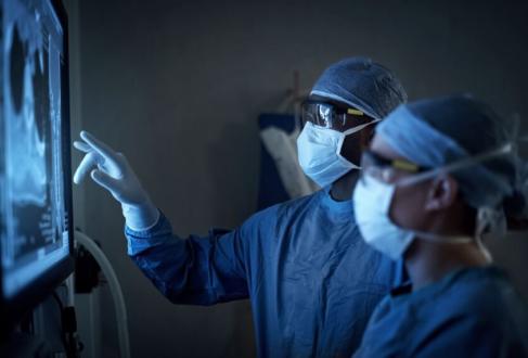 Photo of doctors looking at tumor images